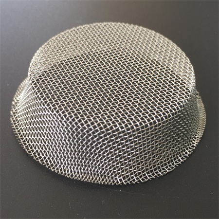 A wire mesh filter with hollow center is on the back ground.